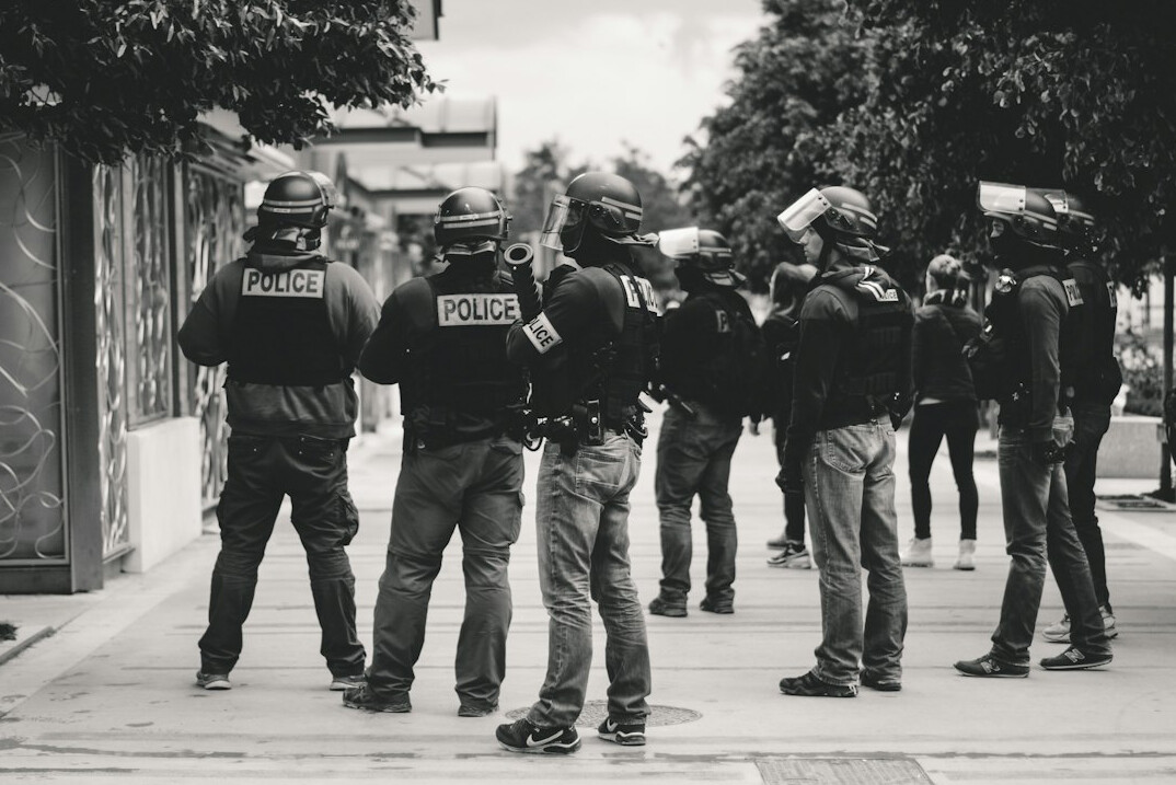 police arresting suspects