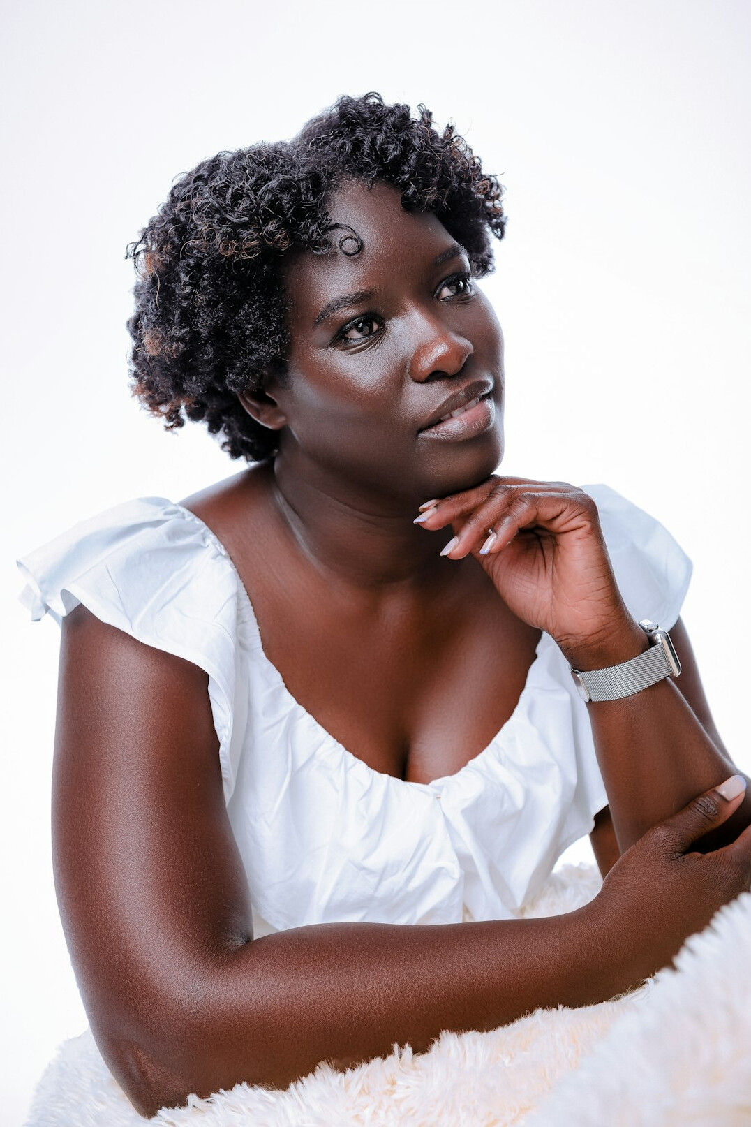Studio portrait of an Afro-Uruguayan woman in her 30s, investigative journalist, neutral background